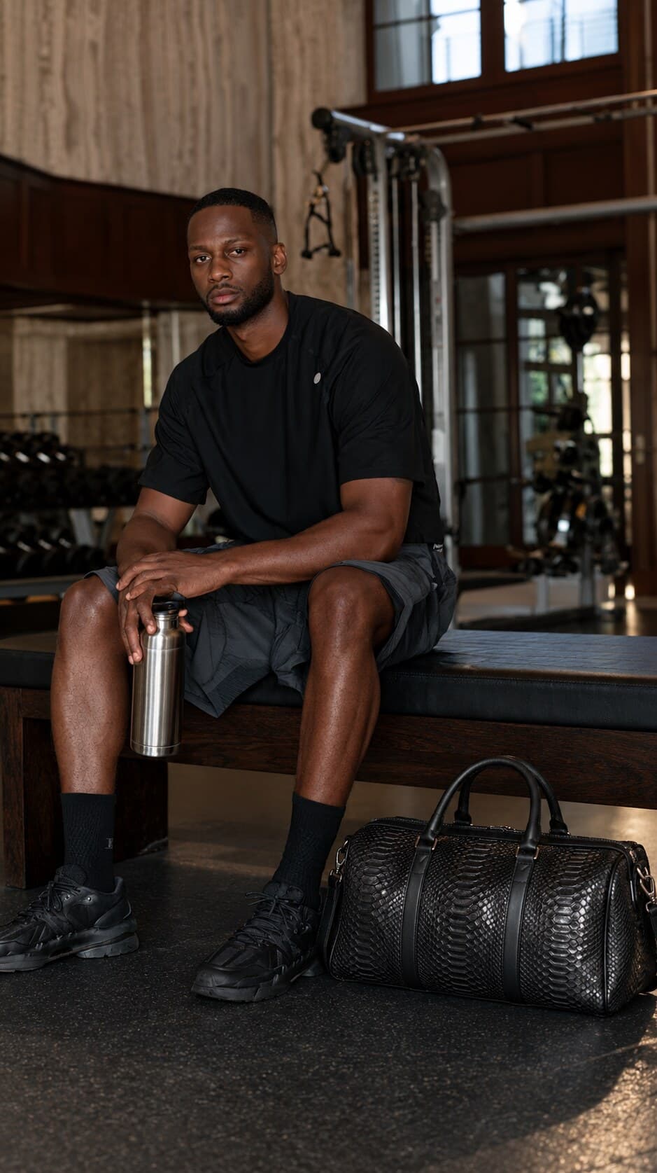 The Dom Bag in Black, carried