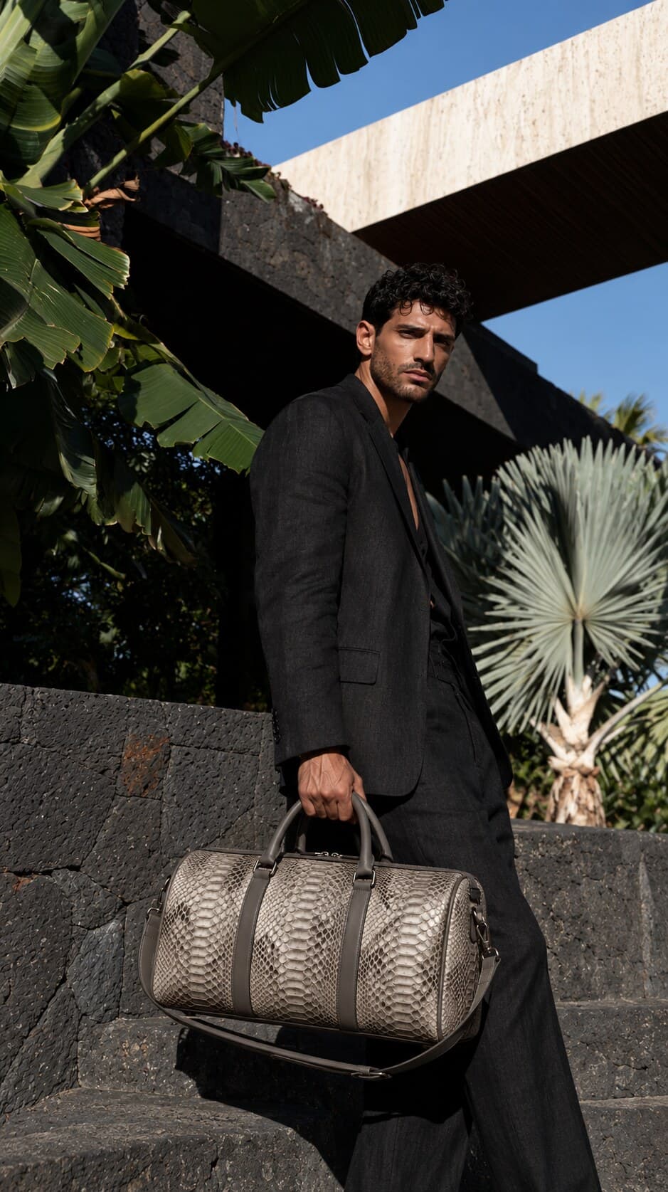 The Dom Bag in Himalayan Grey, carried